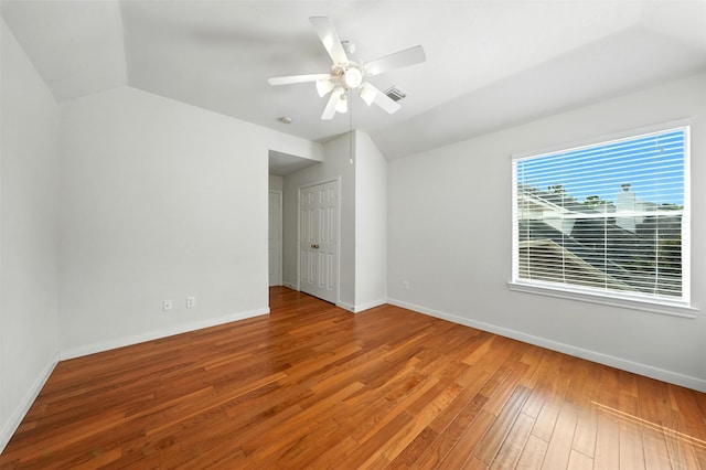 21306 Willowford Park Dr, Katy, TX 77450 - empty room with vaulted ceiling, wood-type flooring, and ceiling fan