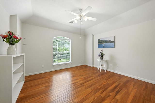 21306 Willowford Park Dr, Katy, TX 77450 - empty room with wood finished floors, ceiling fan, and vaulted ceiling