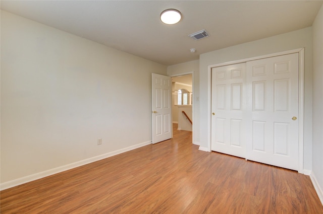 21306 Branford Hills Ln, Katy, TX 77450 - unfurnished bedroom with light wood-type flooring and a closet