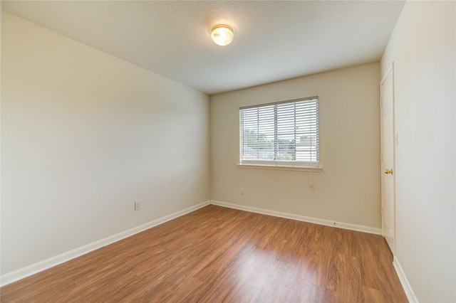 21306 Branford Hills Ln, Katy, TX 77450 - spare room featuring wood finished floors and baseboards