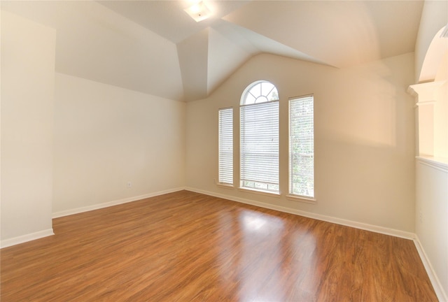 21306 Branford Hills Ln, Katy, TX 77450 - empty room with lofted ceiling and wood finished floors