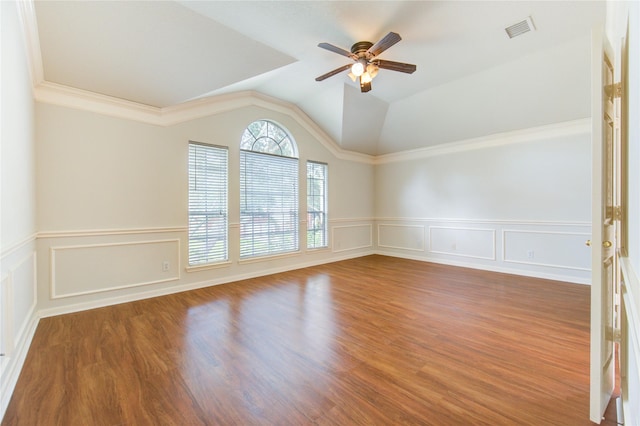 21306 Branford Hills Ln, Katy, TX 77450 - empty room featuring ceiling fan, a decorative wall, wainscoting, vaulted ceiling, and wood finished floors