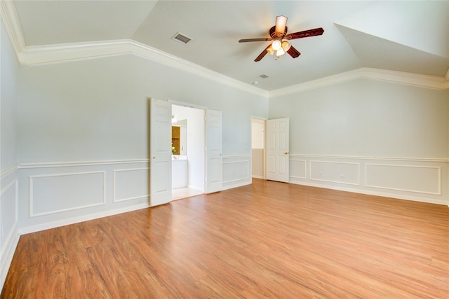 21306 Branford Hills Ln, Katy, TX 77450 - spare room featuring vaulted ceiling, ceiling fan, crown molding, a decorative wall, and light wood-style flooring