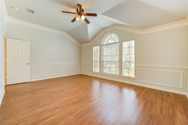 21306 Branford Hills Ln, Katy, TX 77450 - spare room featuring a ceiling fan, wainscoting, vaulted ceiling, ornamental molding, and a decorative wall