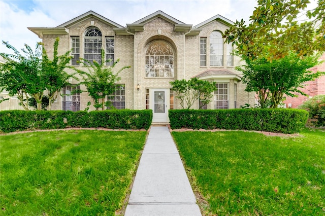 21306 Branford Hills Ln, Katy, TX 77450 - view of front of property with brick siding and a front lawn