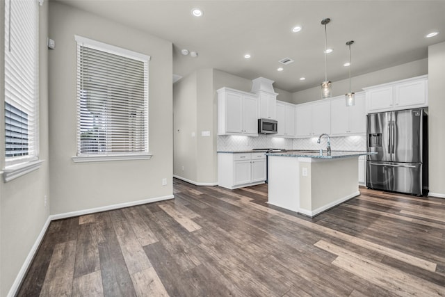 16114 Northern Cardinal Ln, Cypress, TX 77433 - kitchen featuring stainless steel appliances, decorative backsplash, dark wood-style flooring, white cabinetry, and recessed lighting