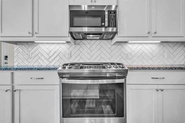 16114 Northern Cardinal Ln, Cypress, TX 77433 - kitchen with stainless steel appliances, decorative backsplash, and white cabinetry