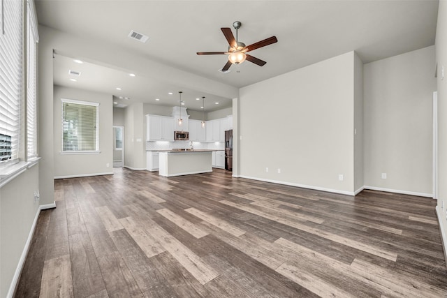 16114 Northern Cardinal Ln, Cypress, TX 77433 - unfurnished living room with a ceiling fan, dark wood-style flooring, and recessed lighting