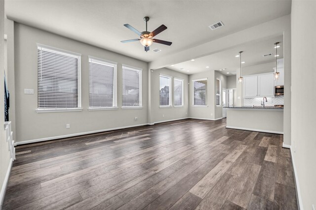 16114 Northern Cardinal Ln, Cypress, TX 77433 - unfurnished living room featuring a ceiling fan, dark wood-style floors, and recessed lighting