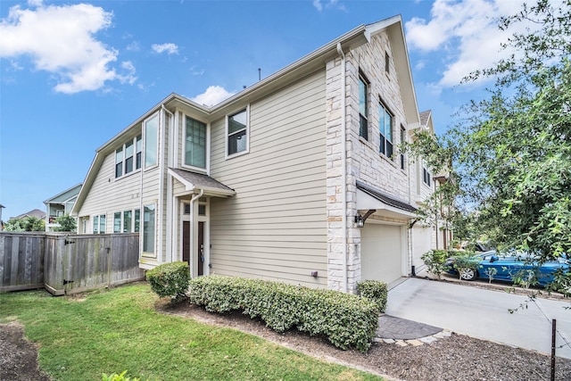 16114 Northern Cardinal Ln, Cypress, TX 77433 - view of property exterior featuring an attached garage and driveway