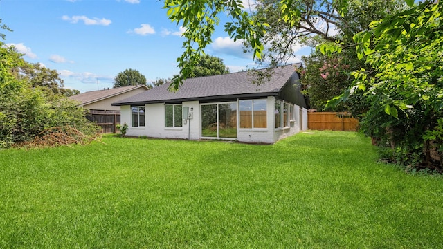 8603 Twisting Vine Ln, Houston, TX 77040 - back of house with a fenced backyard, brick siding, and roof with shingles