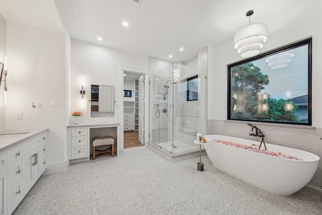 1310 Willard, Houston, TX 77006 - full bath featuring vanity, a stall shower, a freestanding tub, a spacious closet, and recessed lighting