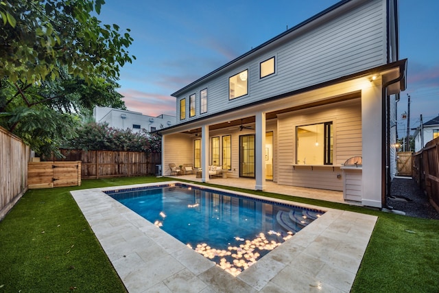 1310 Willard, Houston, TX 77006 - back of house at dusk with a patio area, ceiling fan, a fenced backyard, and an outdoor hangout area