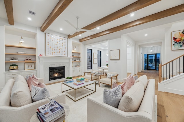 1310 Willard, Houston, TX 77006 - living area featuring ceiling fan, light wood-type flooring, recessed lighting, a premium fireplace, and stairway