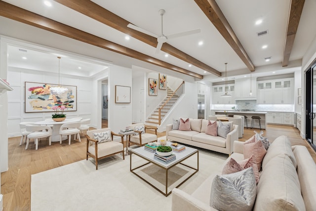 1310 Willard, Houston, TX 77006 - living area with light wood finished floors, stairs, beam ceiling, recessed lighting, and a ceiling fan