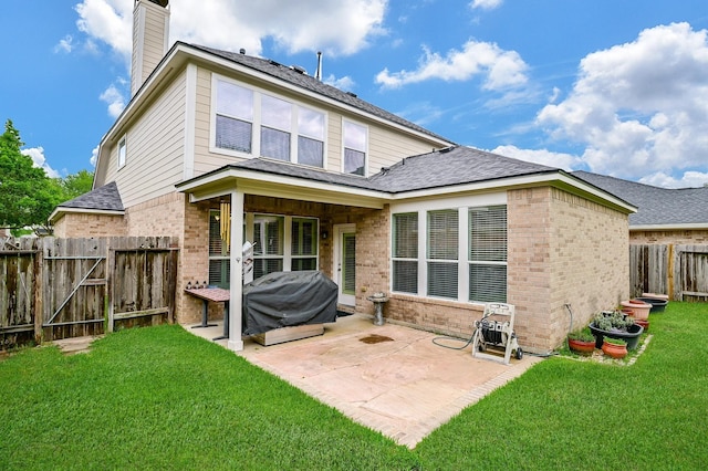 28123 Canyon Wren Dr, Katy, TX 77494 - back of house featuring brick siding, a patio area, a chimney, and a fenced backyard