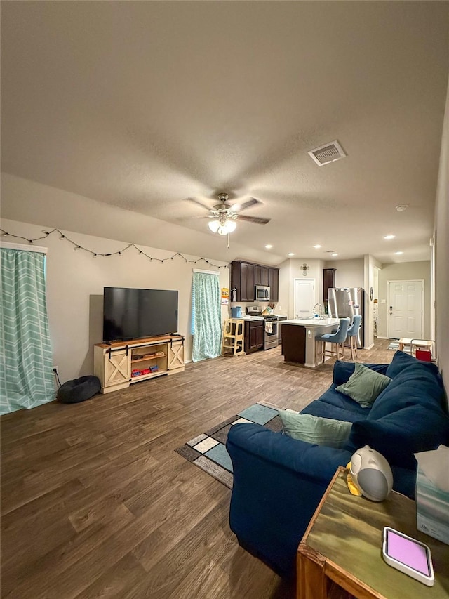 706 Zinnia Ct, Rosharon, TX 77583 - living room with wood finished floors, ceiling fan, and recessed lighting
