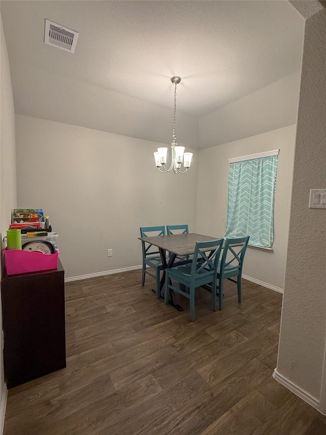706 Zinnia Ct, Rosharon, TX 77583 - dining space with dark wood-type flooring, a chandelier, and vaulted ceiling