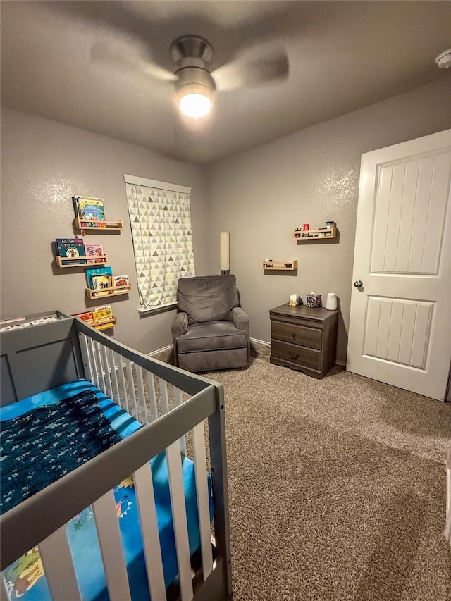 706 Zinnia Ct, Rosharon, TX 77583 - bedroom with a crib, carpet, and a ceiling fan