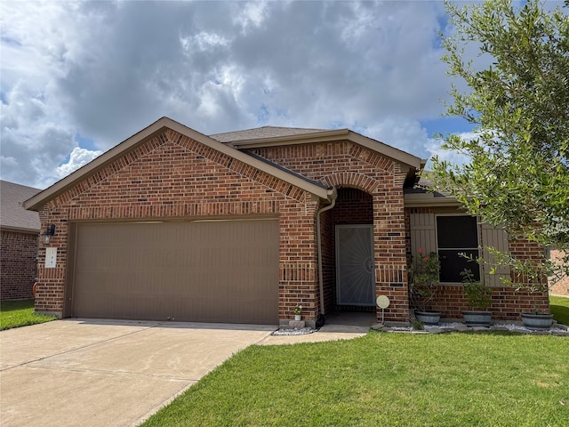 706 Zinnia Ct, Rosharon, TX 77583 - ranch-style house with brick siding, a garage, concrete driveway, a front lawn, and a shingled roof