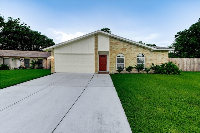 22843 Post Gate Dr, Spring, TX 77373 - mid-century home with driveway, an attached garage, and brick siding