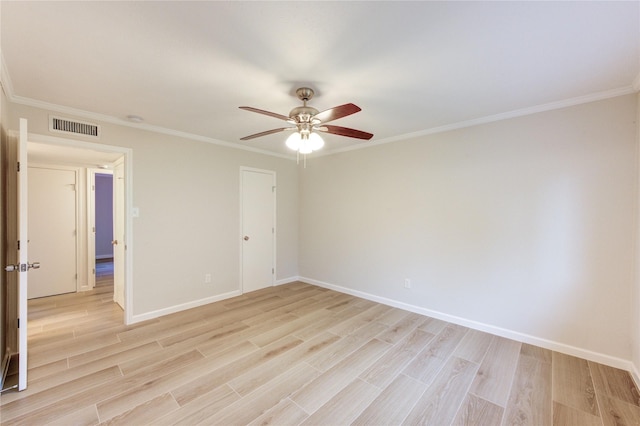 22843 Post Gate Dr, Spring, TX 77373 - empty room featuring a ceiling fan, light wood-style flooring, and ornamental molding