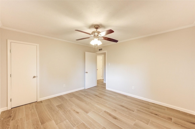 22843 Post Gate Dr, Spring, TX 77373 - spare room featuring light wood-style floors, ceiling fan, and ornamental molding