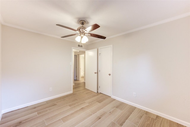 22843 Post Gate Dr, Spring, TX 77373 - unfurnished room with light wood-style floors, ceiling fan, and ornamental molding
