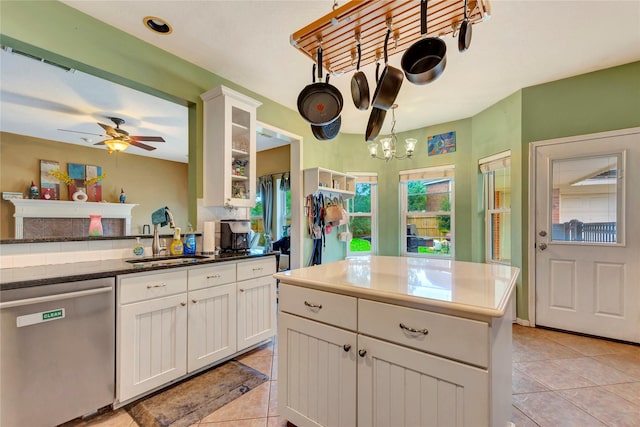 2605 Broussard Ct, Seabrook, TX 77586 - kitchen featuring dishwasher, light tile patterned flooring, white cabinetry, a ceiling fan, and glass insert cabinets