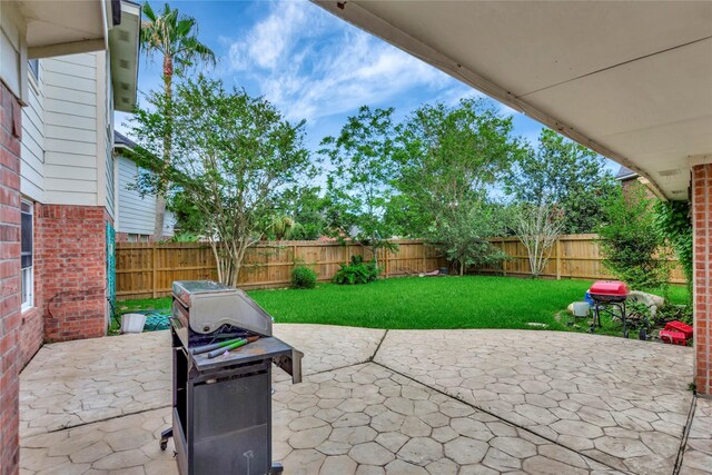 2605 Broussard Ct, Seabrook, TX 77586 - fenced backyard featuring a patio area and area for grilling