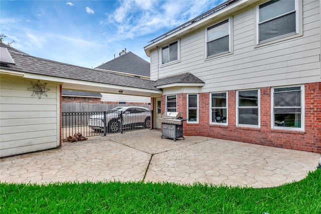2605 Broussard Ct, Seabrook, TX 77586 - back of house featuring a patio and brick siding