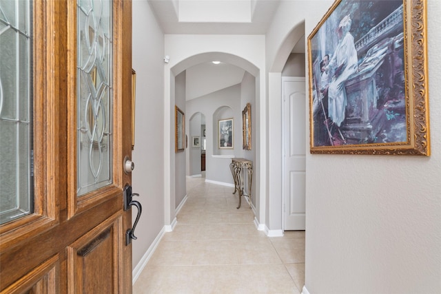 28035 Emma Gardens Ln, Spring, TX 77386 - foyer with arched walkways and light tile patterned floors