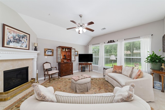 28035 Emma Gardens Ln, Spring, TX 77386 - living area with vaulted ceiling, ceiling fan, and a tiled fireplace