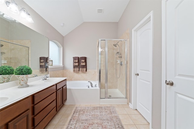 28035 Emma Gardens Ln, Spring, TX 77386 - bathroom with a stall shower, a bath, tile patterned floors, double vanity, and vaulted ceiling