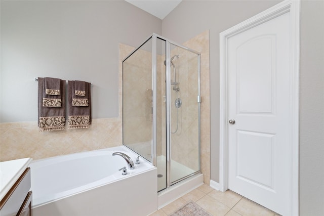 28035 Emma Gardens Ln, Spring, TX 77386 - full bathroom featuring a shower stall, a garden tub, vanity, and tile patterned floors
