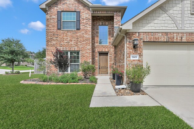2803 Ridgecliff Ct, Conroe, TX 77301 - view of front facade featuring a front lawn, brick siding, driveway, and an attached garage