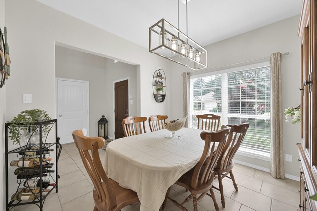 2803 Ridgecliff Ct, Conroe, TX 77301 - dining room with light tile patterned flooring and a chandelier