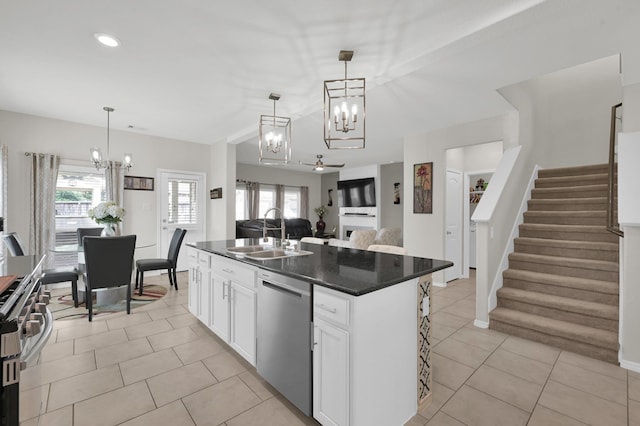 2803 Ridgecliff Ct, Conroe, TX 77301 - kitchen with dishwasher, a chandelier, range, light tile patterned flooring, and white cabinets