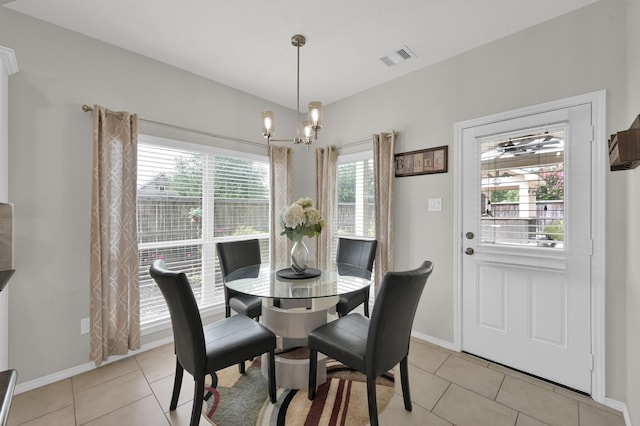 2803 Ridgecliff Ct, Conroe, TX 77301 - dining space featuring healthy amount of natural light, a chandelier, and light tile patterned floors