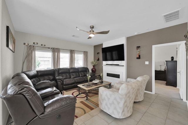 2803 Ridgecliff Ct, Conroe, TX 77301 - living room with ceiling fan, light tile patterned flooring, and a fireplace