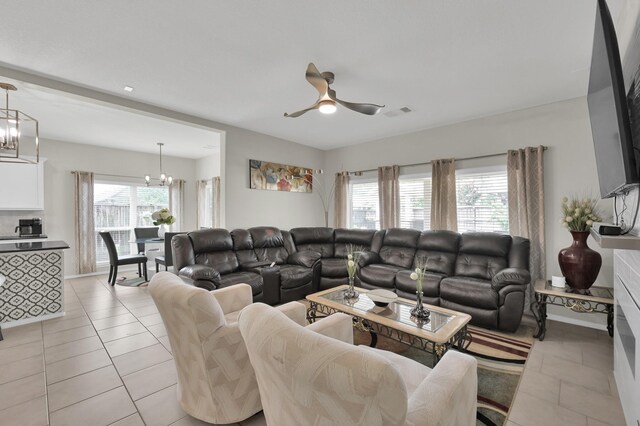 2803 Ridgecliff Ct, Conroe, TX 77301 - living room featuring a chandelier, ceiling fan, and light tile patterned floors