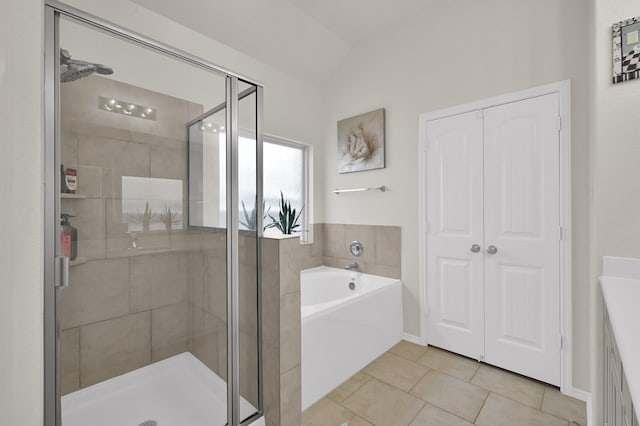 2803 Ridgecliff Ct, Conroe, TX 77301 - bathroom with a bath, tile patterned floors, a shower stall, and vaulted ceiling