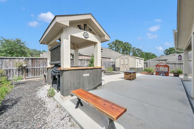 2803 Ridgecliff Ct, Conroe, TX 77301 - fenced backyard with a storage shed and a patio area