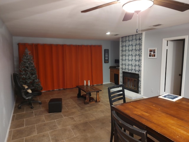 3125 Hells Gate Loop Unit 29, Strawn, TX 76475 - tiled dining area with a ceiling fan, a tile fireplace, and recessed lighting