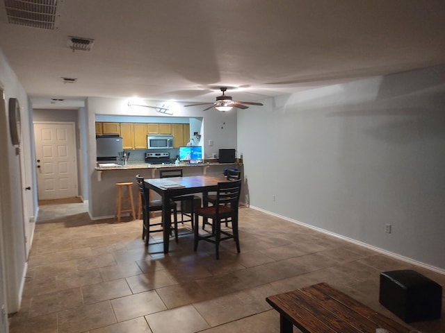 3125 Hells Gate Loop Unit 29, Strawn, TX 76475 - dining area with ceiling fan and tile patterned floors