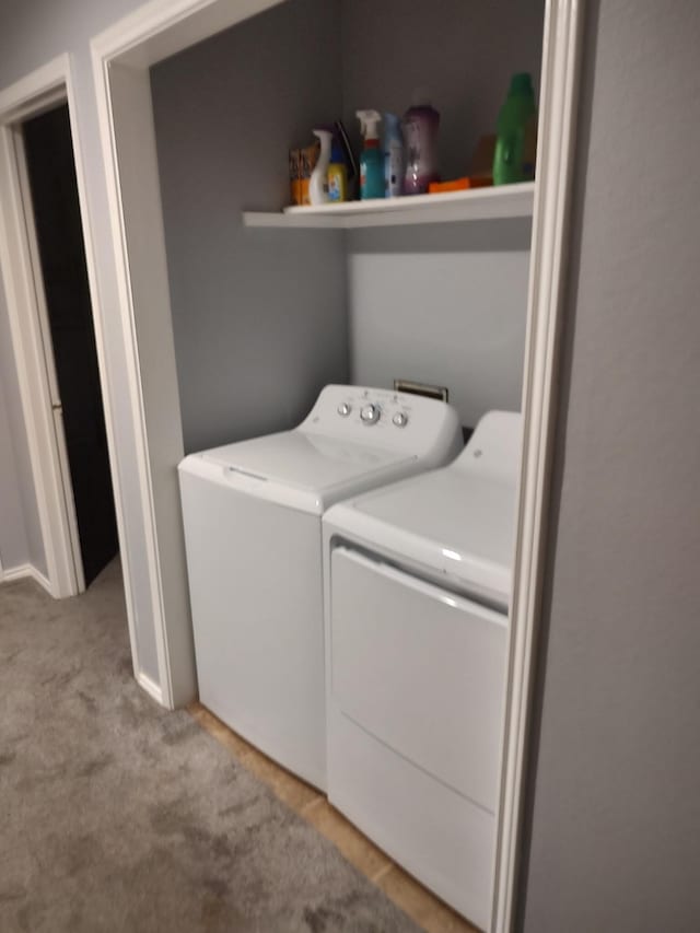 3125 Hells Gate Loop Unit 29, Strawn, TX 76475 - laundry room featuring washing machine and clothes dryer and light colored carpet