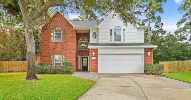 6107 Kyle Bend Ln, Katy, TX 77493 - traditional-style house featuring a garage, driveway, brick siding, and a shingled roof