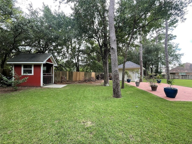 6107 Kyle Bend Ln, Katy, TX 77493 - view of yard with an outbuilding and a deck