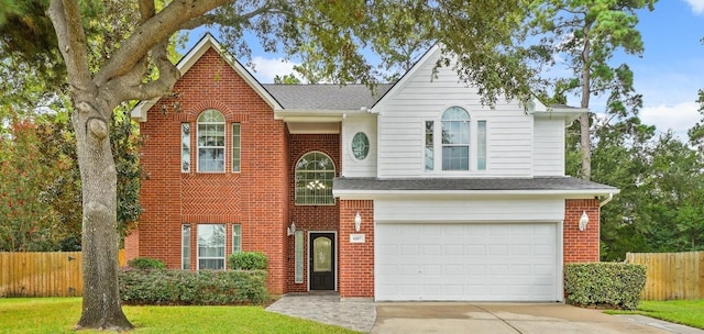 6107 Kyle Bend Ln, Katy, TX 77493 - traditional-style home with concrete driveway, an attached garage, brick siding, and a shingled roof
