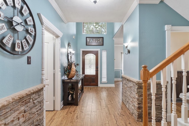 6107 Kyle Bend Ln, Katy, TX 77493 - foyer entrance featuring light wood finished floors, ornamental molding, and stairs
